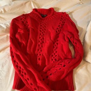 Express red  sweater with cut out pattern